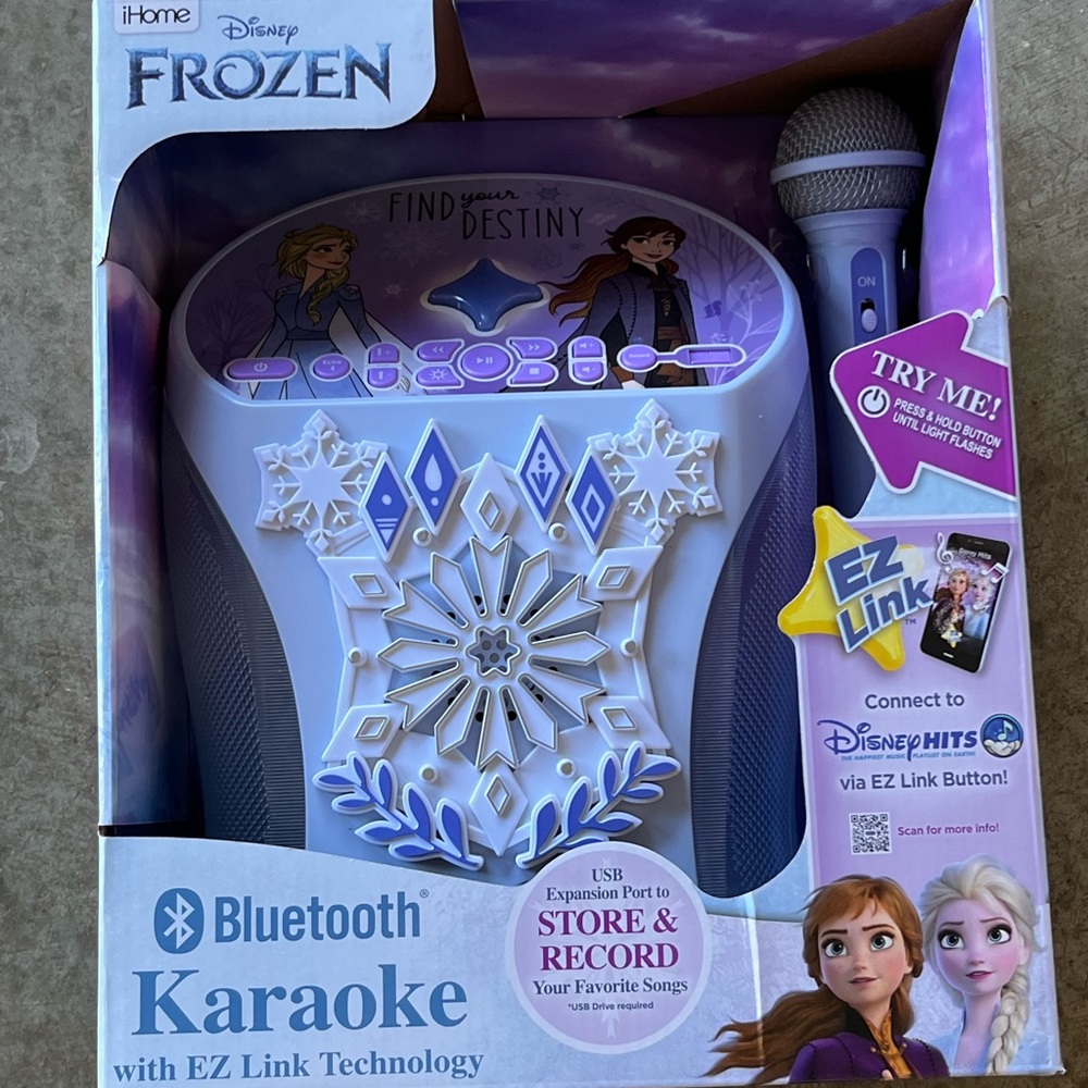 Frozen karaoke machine, new in box. Bluetooth capability.